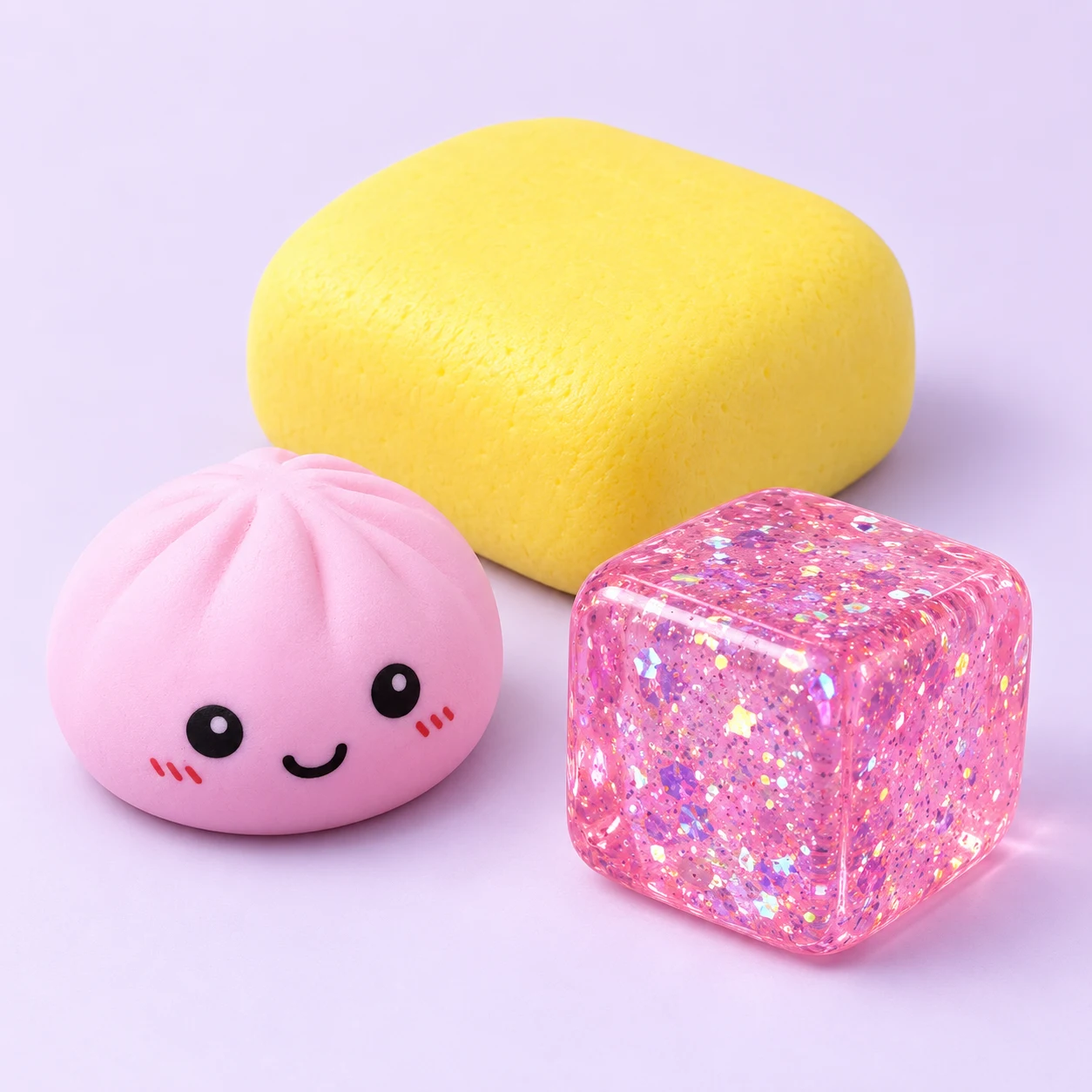A playful collection of soft butter, dumpling and glitter cube squishies